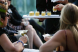 Peer group members and guests enjoy the lovely rooftop setting at the London Hotel in West Hollywood, California.