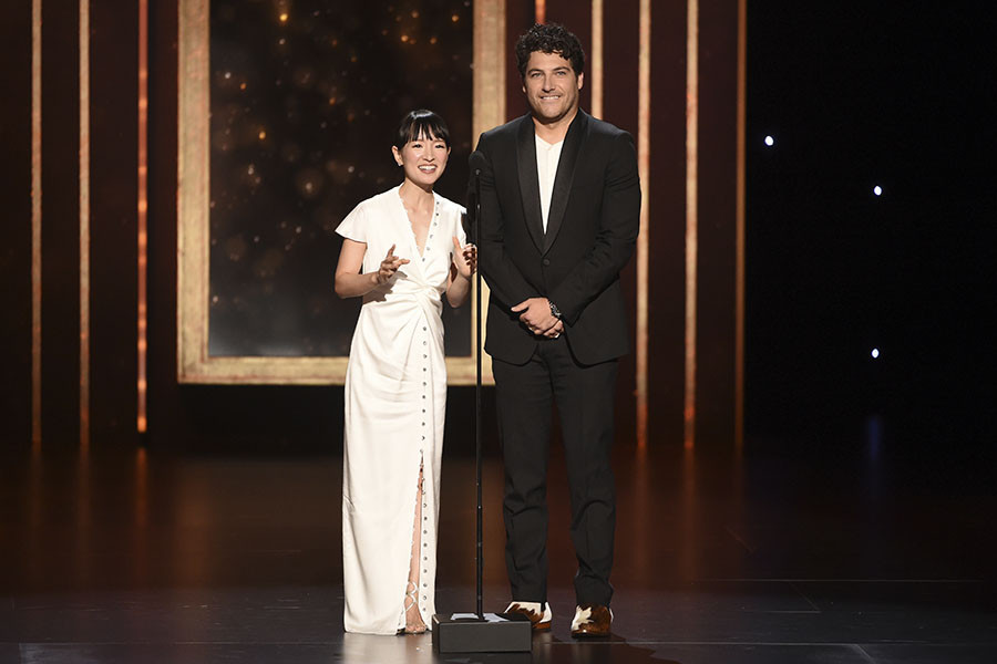 Marie Kondo and Adam Pally present an award at the 2019 Creative Arts Emmys.