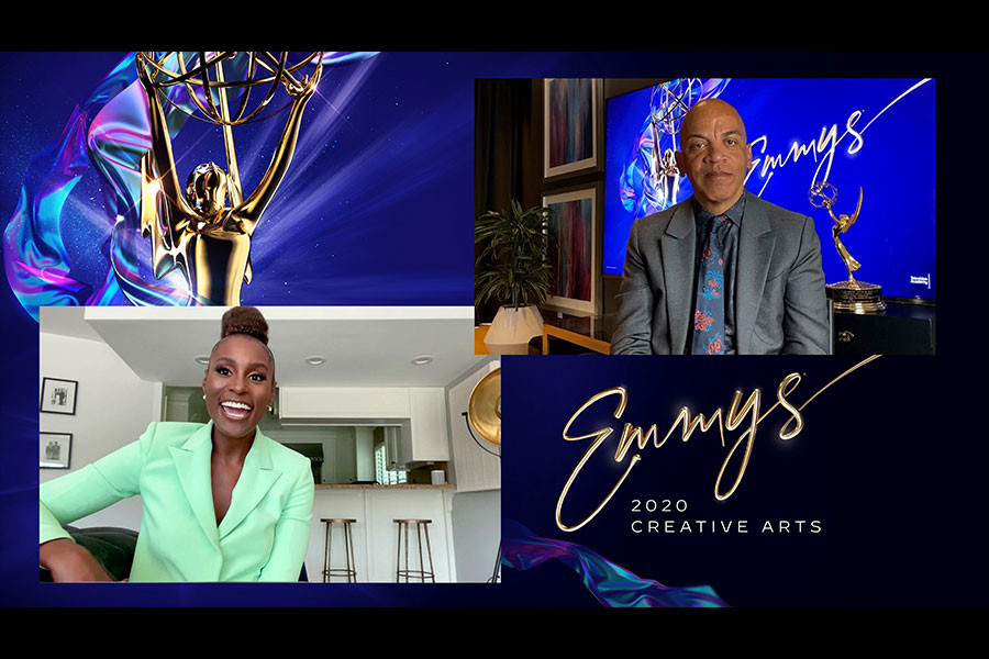 Issa Rae presents the award for Outstanding Music Direction to Rickey Minor for The Kennedy Center Honors during the second night of the Creative Arts Emmys.