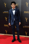 Lance Lim arrives on the red carpet at the 2016 Creative Arts Emmys.