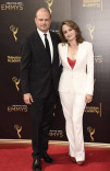 Brad Simpson and Nina Jacobson on the red carpet at the 2016 Creative Arts Emmys. 