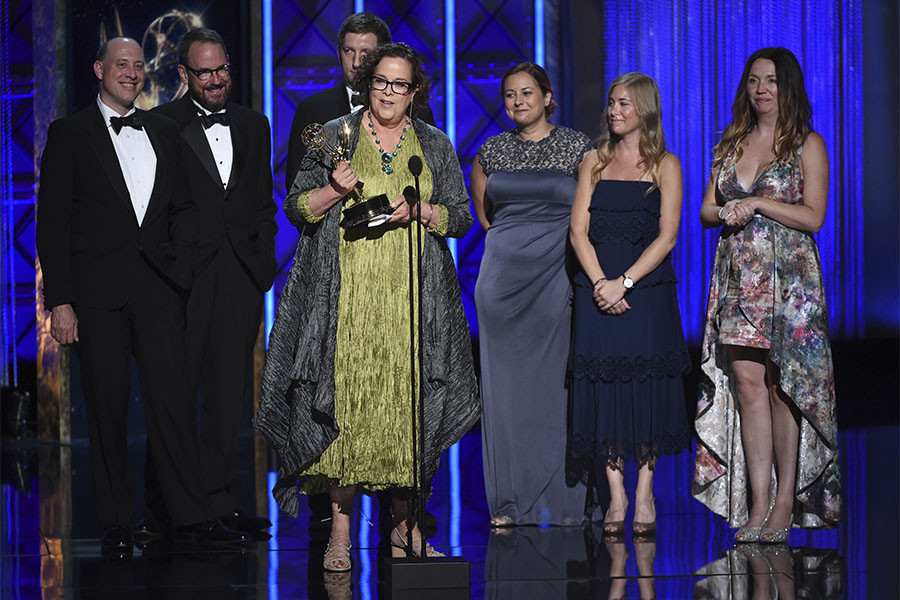 The team of Once Upon a Sesame Street Christmas accepts their award at the 2017 Creative Arts Emmys.