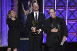 Janet Gegan, wife of winner Gary Gegan, Clark Germain, and Andy D'Addario accept their award at the 2017 Creative Arts Emmys. 