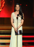 Lucy Liu of Elementary presents an award at the 66th Emmys.