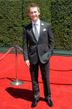 Jason Dolley arrives for the 2014 Primetime Creative Arts Emmys.