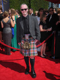 Neville Kidd arrives for the 2014 Primetime Creative Arts Emmys.