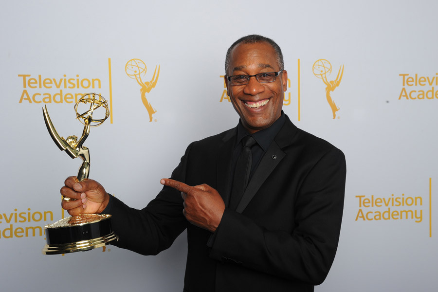 Joe Morton of Scandal celebrates at the 2014 Primetime Creative Arts Emmys.