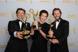 Paul Ghirardani, Deborah Riley and Rob Cameron celebrate their win at the 2014 Primetime Creative Arts Emmys.