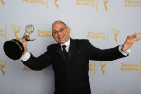 Peter Chakos celebrates at the 2014 Primetime Creative Arts Emmys.