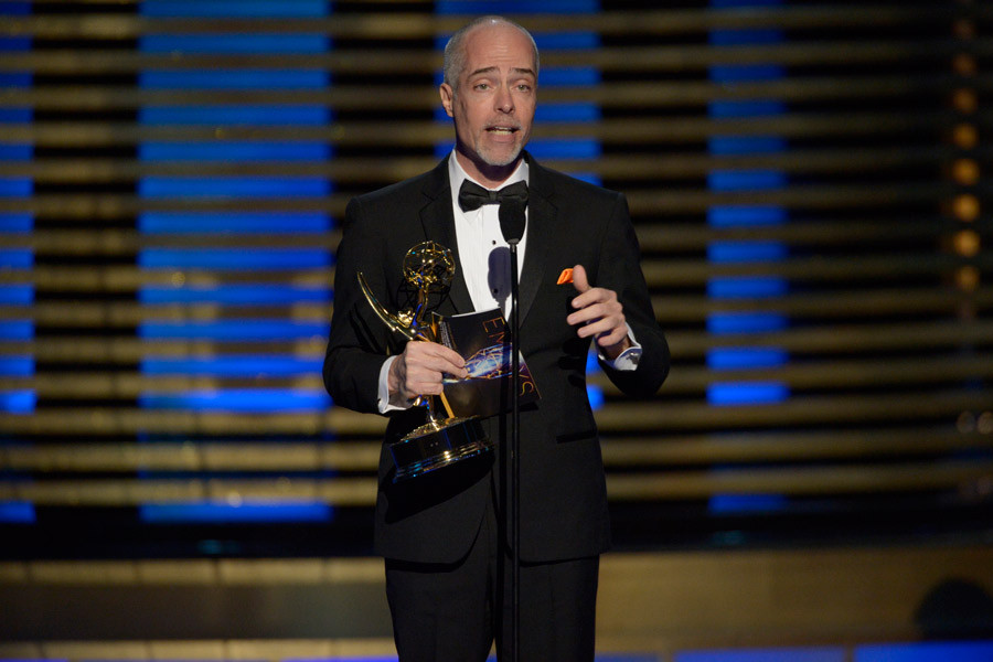 Editor William Turro of Orange is the New Black accepts an award at the 2014 Primetime Creative Arts Emmys.   