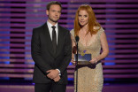 Patrick J. Adams and Sarah Rafferty present an award at the 2014 Primetime Creative Arts Emmys.