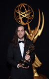 Sean Szeles celebrates at the 2014 Primetime Creative Arts Emmys.
