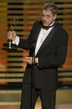 Editor Eric Davies accepts an award at the 2014 Primetime Creative Arts Emmys.   