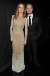 Sarah Rafferty (l) and Patrick J. Adams (r) of Suits at the 2014 Primetime Creative Arts Emmys.