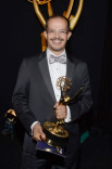 Pablo Munguia celebrates at the 2014 Primetime Creative Arts Emmys.