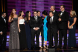 The Shark Tank team accepts an award at the 2014 Primetime Creative Arts Emmys.