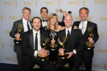Tate Donovan (l) and the 30 For 30 Shorts team celebrate their win at the 2014 Primetime Creative Arts Emmys.