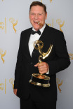 Brooklyn Nine-Nine stunt coordinator Norman Howell celebrates his win at the 2014 Primetime Creative Arts Emmys.