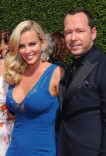 Jenny McCarthy and Donnie Wahlburg of Wahlburgers arrive for the 2014 Primetime Creative Arts Emmys.