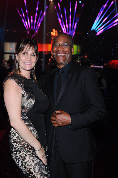 Christine Lietz (l) and Scandal winner Joe Morton (r) celebrate at the 2014 Creative Arts Emmys ball.
