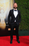 Dustin O'Halloran arrives on the red carpet at the Creative Arts Emmy Awards 2015.