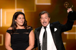 Regina Graves and Howard Cummings accept their award at the 2015 Creative Arts Emmys.