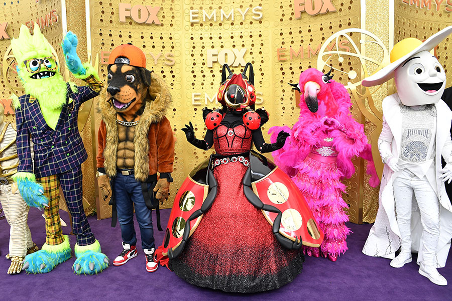 The cast of The Masked Singer on the red carpet at the 71st Emmy Awards.