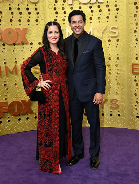 Nicole Bordges and Jon Huertas on the red carpet at the 71st Emmy Awards.