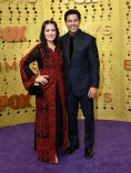Nicole Bordges and Jon Huertas on the red carpet at the 71st Emmy Awards.