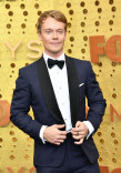 Alfie Allen on the red carpet at the 71st Emmy Awards.