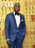 Akbar Gbaja-Biamila on the red carpet at the 71st Emmy Awards.