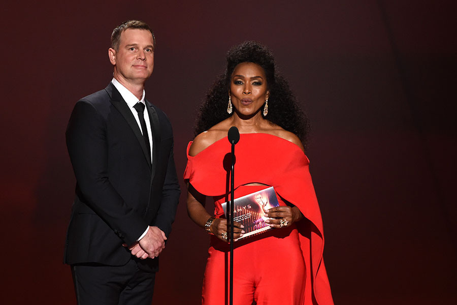 Peter Krause and Angela Bassett present an award at the 71st Emmy Awards.