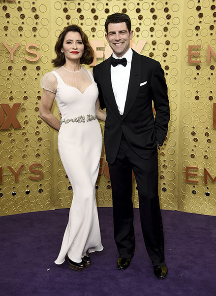 Tess Sanchez and Max Greenfield on the red carpet at the 71st Emmy Awards.