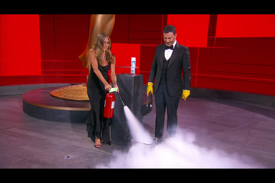 Jennifer Aniston and Jimmy Kimmel sanitize the winner&#039;s envelope at the 72nd Emmy Awards.