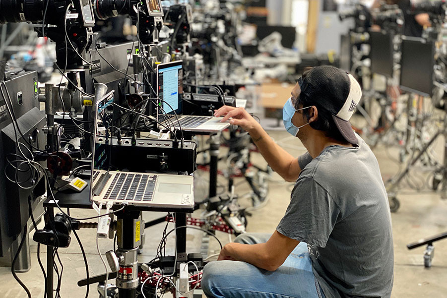 Sergio Santana checks the camera kits sent to nominees.