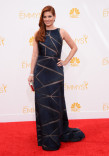 Debra Messing arrives at the 66th Emmy Awards.