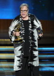 Kathy Bates of American Horror Story: Coven accepts an award at the 66th Emmys.