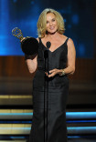 Jessica Lange of American Horror Story: Coven accepts an award at the 66th Emmy Awards.