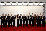 The producers of The Amazing Race celebrate at the 66th Emmy Awards.