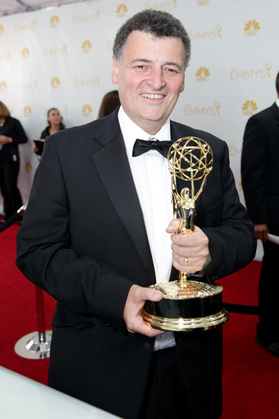 Sherlock writer Steven Moffat celebrates his win at the 66th Emmy Awards.
