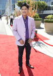 Johnny Ortiz on the red carpet at the 67th Emmy Awards.