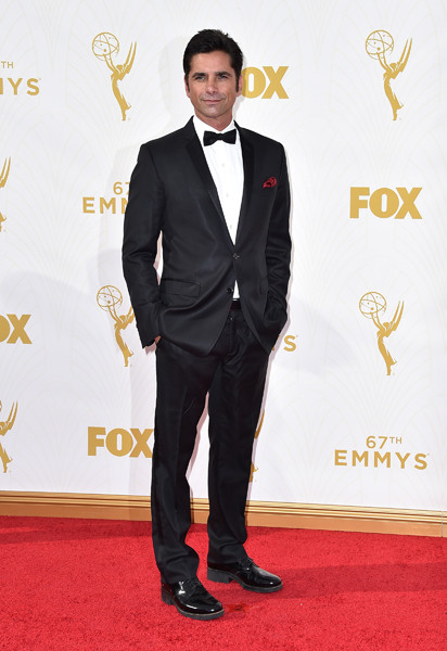 John Stamos on the red carpet at the 67th Emmy Awards.