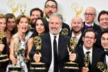 Jon Stewart and the team for "The Daily Show with Jon Stewart" backstage at the 67th Emmy Awards.