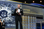 Charlie Brooker accepts his award at the 69th Emmy Awards.