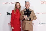 Dana Walden and Ryan Murphy on a step and repeat