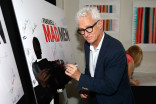 John Slattery signs the poster at &quot;A Farewell to Mad Men,&quot; May 17, 2015 at the Montalbán Theater in Hollywood, California.