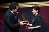 Mitchell Hurwitz presents an award to Shin Yin Hiyu at the 36th College Television Awards at the Skirball Cultural Center in Los Angeles, California, April 23, 2015.