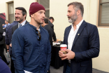 Joel Lambert chats with a guest at the Got Your 6 Storytellers event, November 10, 2015, in Los Angeles, California.
