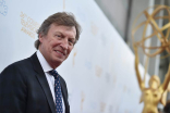Presenter Nigel Lythgoe arrives at the 36th College Television Awards at the Skirball Cultural Center in Los Angeles, April 23, 2015.