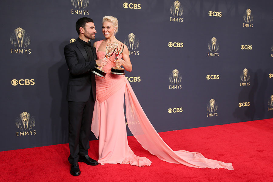 Brett Goldstein and Hannah Waddingham pose with their awards at the 73rd Emmy Awards, September 19, 2021 in Los Angeles, California. 